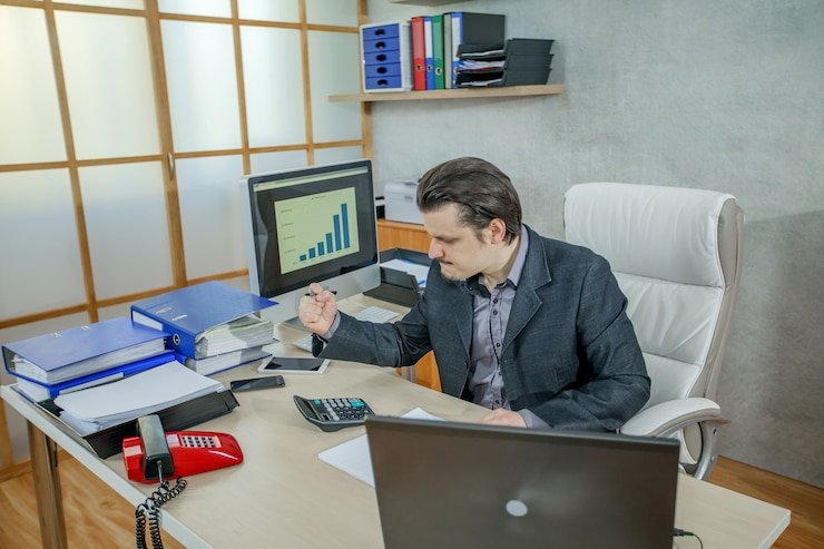 A group of finance professionals analyzing data in a modern office in the U.S.