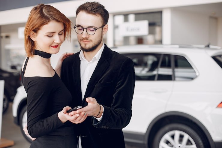 Customer reviewing Hyundai Motor Finance loan terms at dealership