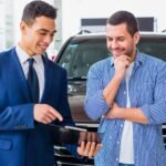 Customer signing Hyundai Finance loan paperwork in dealership 2025