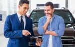 Customer signing Hyundai Finance loan paperwork in dealership 2025