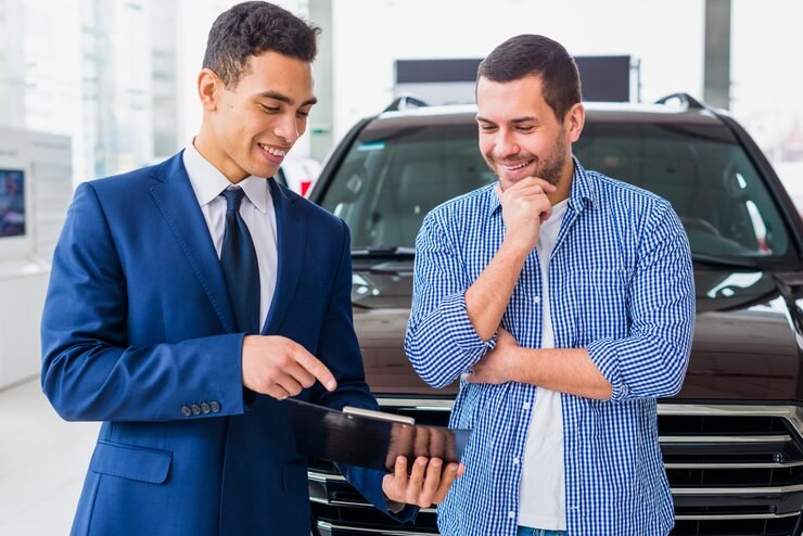 Customer signing Hyundai Finance loan paperwork in dealership 2025