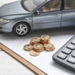 Kia Finance customer signing lease agreement at dealership in 2025