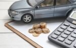 Kia Finance customer signing lease agreement at dealership in 2025