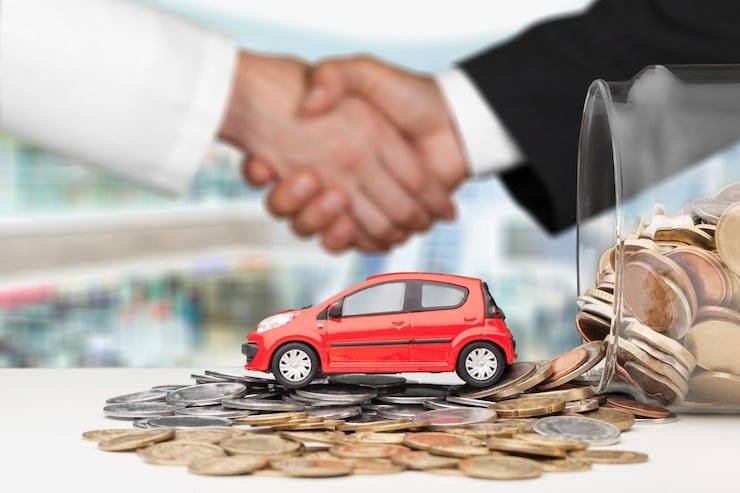 Kia Finance representative helping U.S. customer with auto loan paperwork