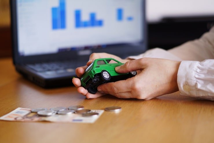 Kia Finance customer signing lease agreement at dealership in 2025