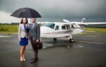 Airplane taking off on airport runway with aviation insurance coverage concept