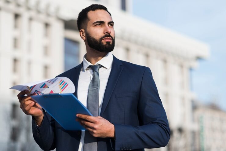 Finance professional reviewing financial data on laptop in U.S. office