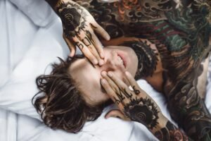 Semicolon tattoo on wrist symbolizing suicide prevention and mental health awareness