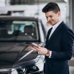 Kia Finance representative helping U.S. customer with auto loan paperwork