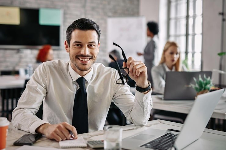 Finance professional reviewing financial data on laptop in U.S. office